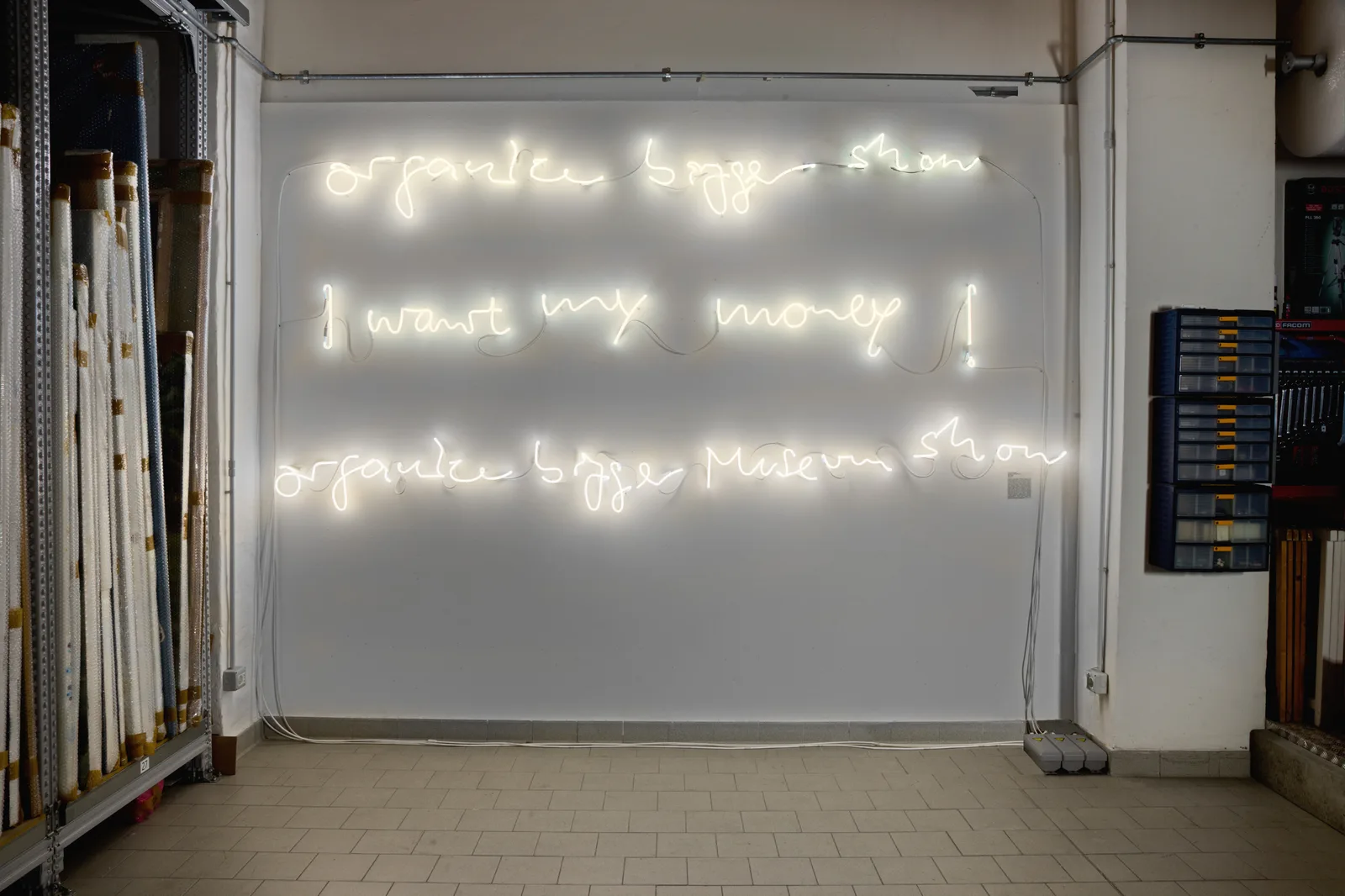 Partial view of the exhibition "Tales ofg a place", Galleria Enrico Astuni, Bologna, 2015. Organize bigger show; I want my money; Organize bigger museum show